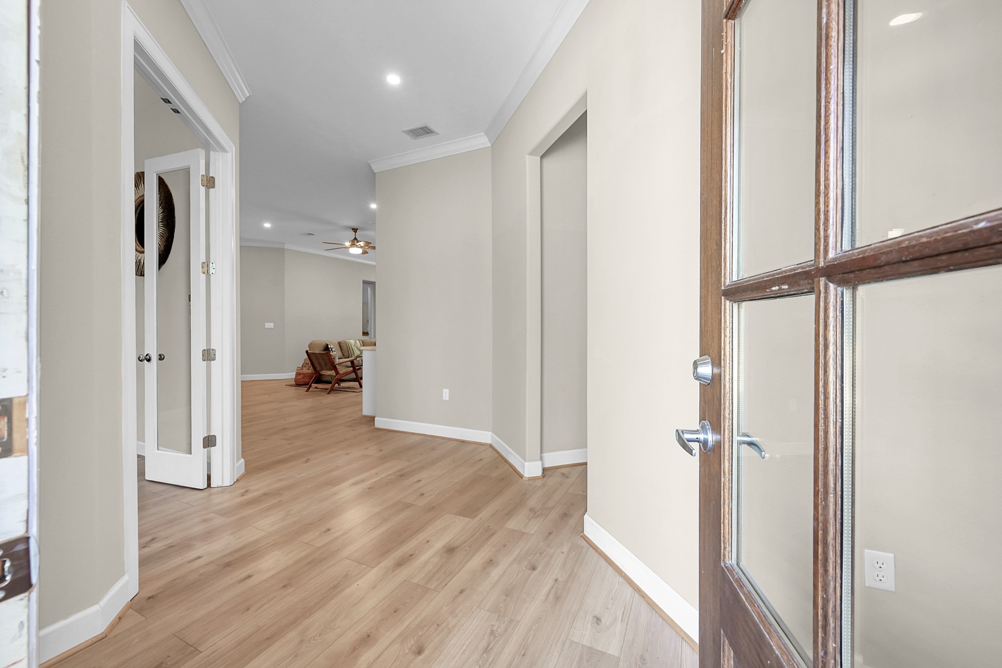 121 Bermuda Circle Montgomery, TX 77356 - Photo 5 of 44 a view of a hallway with wooden floor and a bathroom