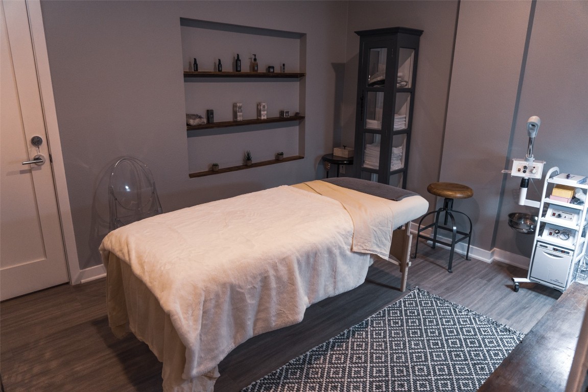 4361 South Congress Avenue, Unit 106 Austin, TX 78745 - Photo 3 of 11 a bedroom with a bed and a book shelf