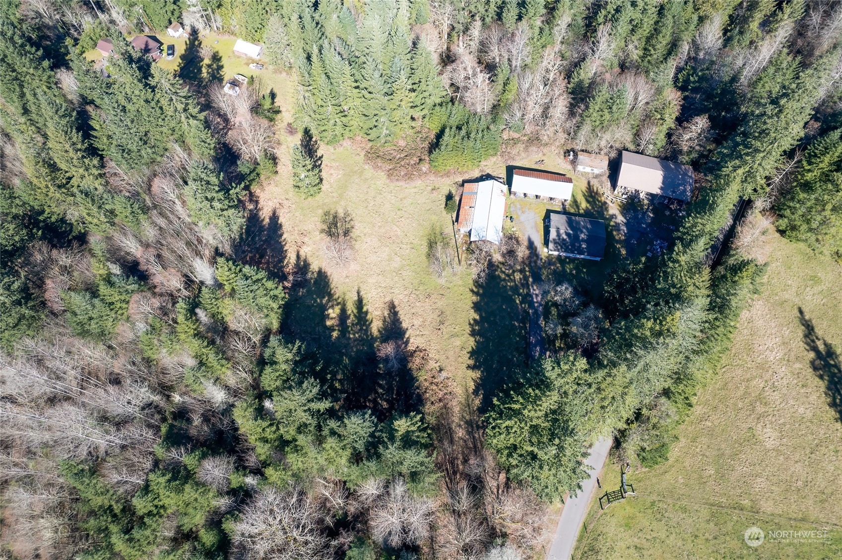 24710 Fisk Road East Orting, WA 98360 - Photo 1 of 25 an aerial view of a house with a yard