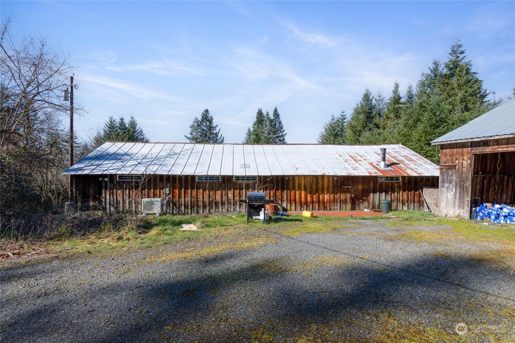 24710 Fisk Road East Orting, WA 98360 - Photo 11 of 25 a backyard of a house with table and chairs