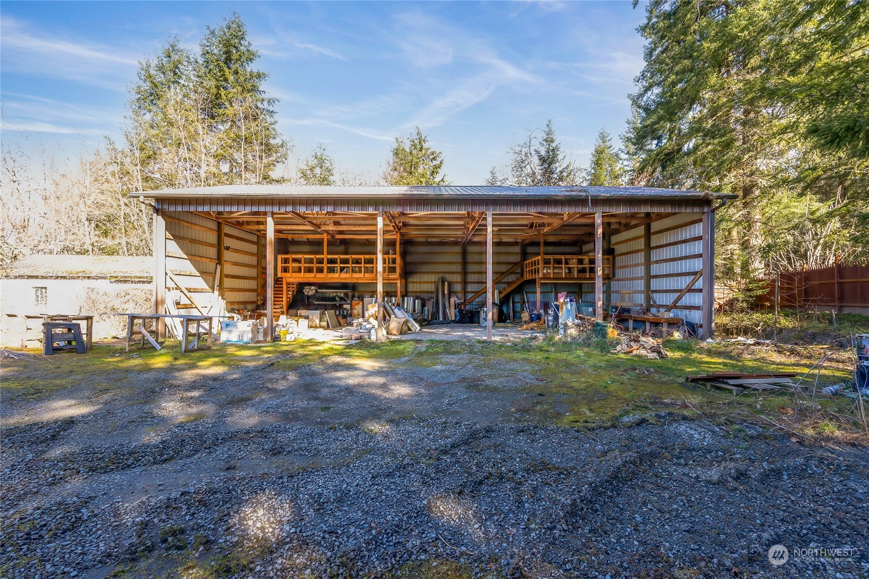 24710 Fisk Road East Orting, WA 98360 - Photo 13 of 25 a view of a house with backyard and porch