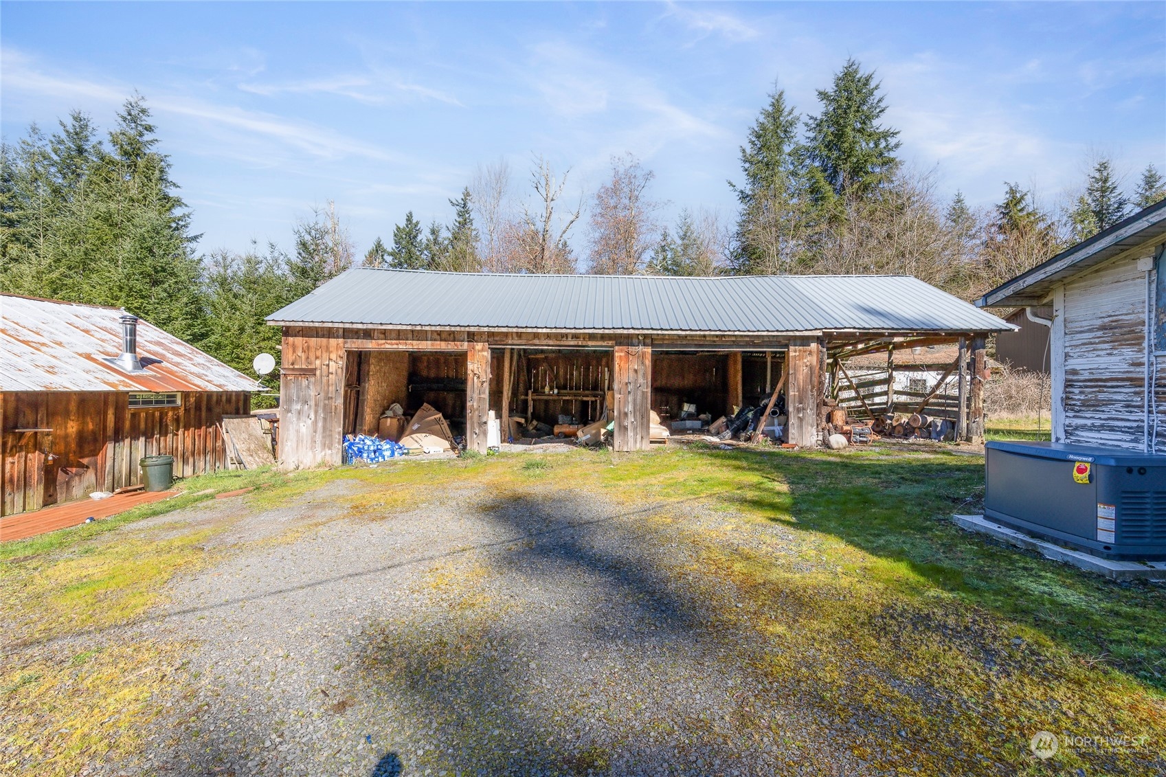 24710 Fisk Road East Orting, WA 98360 - Photo 15 of 25 a front view of a house with swimming pool having outdoor seating
