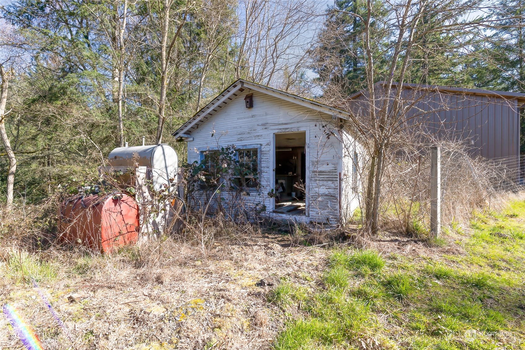 24710 Fisk Road East Orting, WA 98360 - Photo 10 of 25 a backyard of a house with seating space