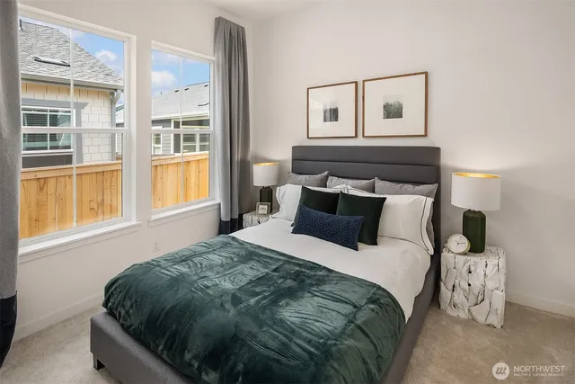 a bedroom with a bed and window