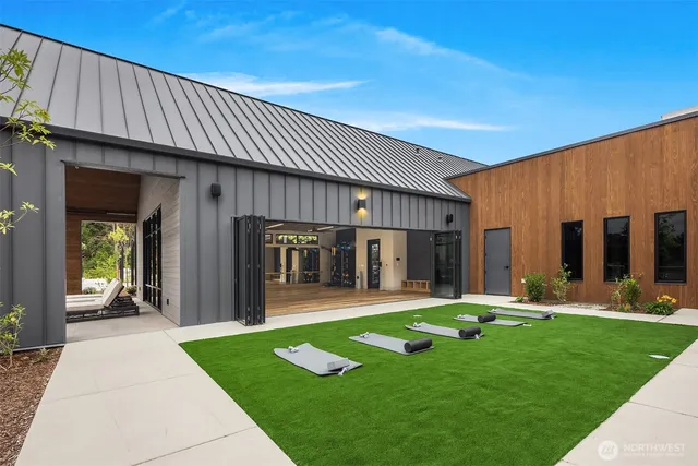 a view of a house with backyard and porch