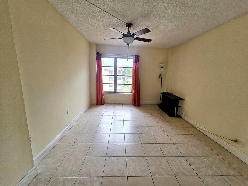 4172 Inverrary Drive, Unit 410 Lauderhill, FL 33319 - Photo 15 of 23 a view of an empty room with a window