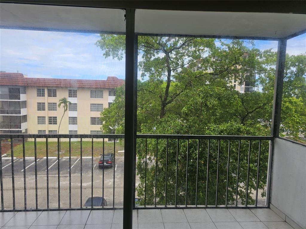 4172 Inverrary Drive, Unit 410 Lauderhill, FL 33319 - Photo 23 of 23 a view of a balcony with a yard