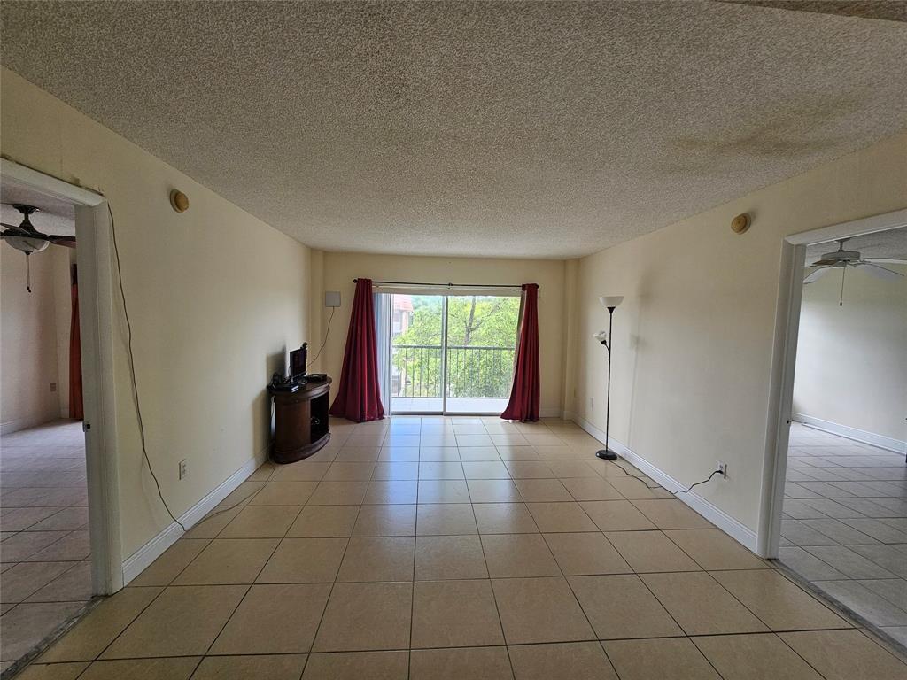 4172 Inverrary Drive, Unit 410 Lauderhill, FL 33319 - Photo 10 of 23 a view of an empty room and window