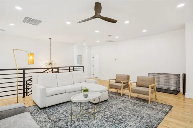 a living room with furniture and a rug