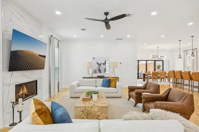 a living room with furniture fireplace and a fireplace