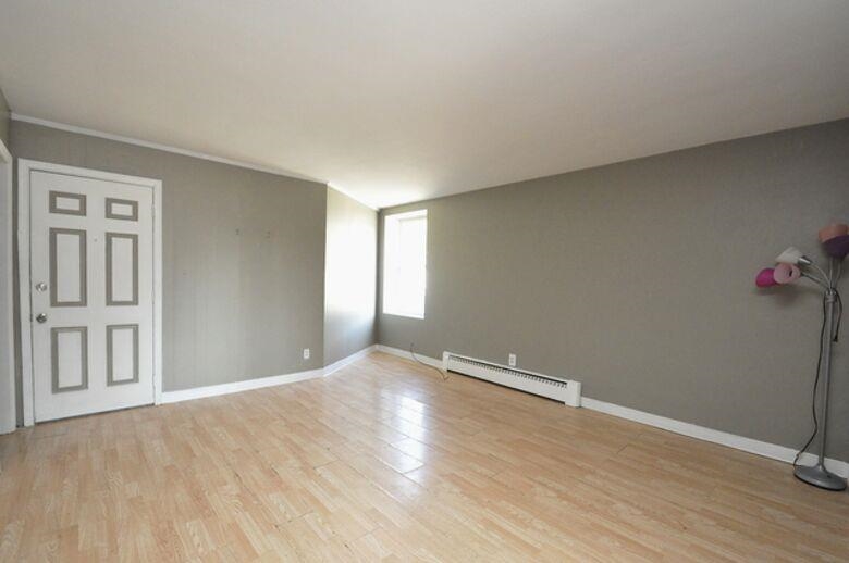 506 Main Street Marseilles, IL 61341 - Photo 3 of 8 a view of an empty room with wooden floor