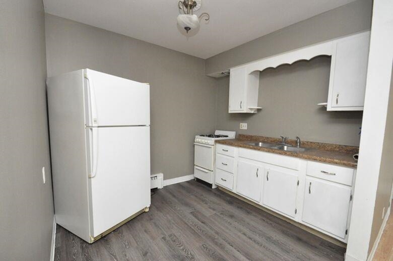506 Main Street Marseilles, IL 61341 - Photo 5 of 8 a kitchen with sink refrigerator and cabinets