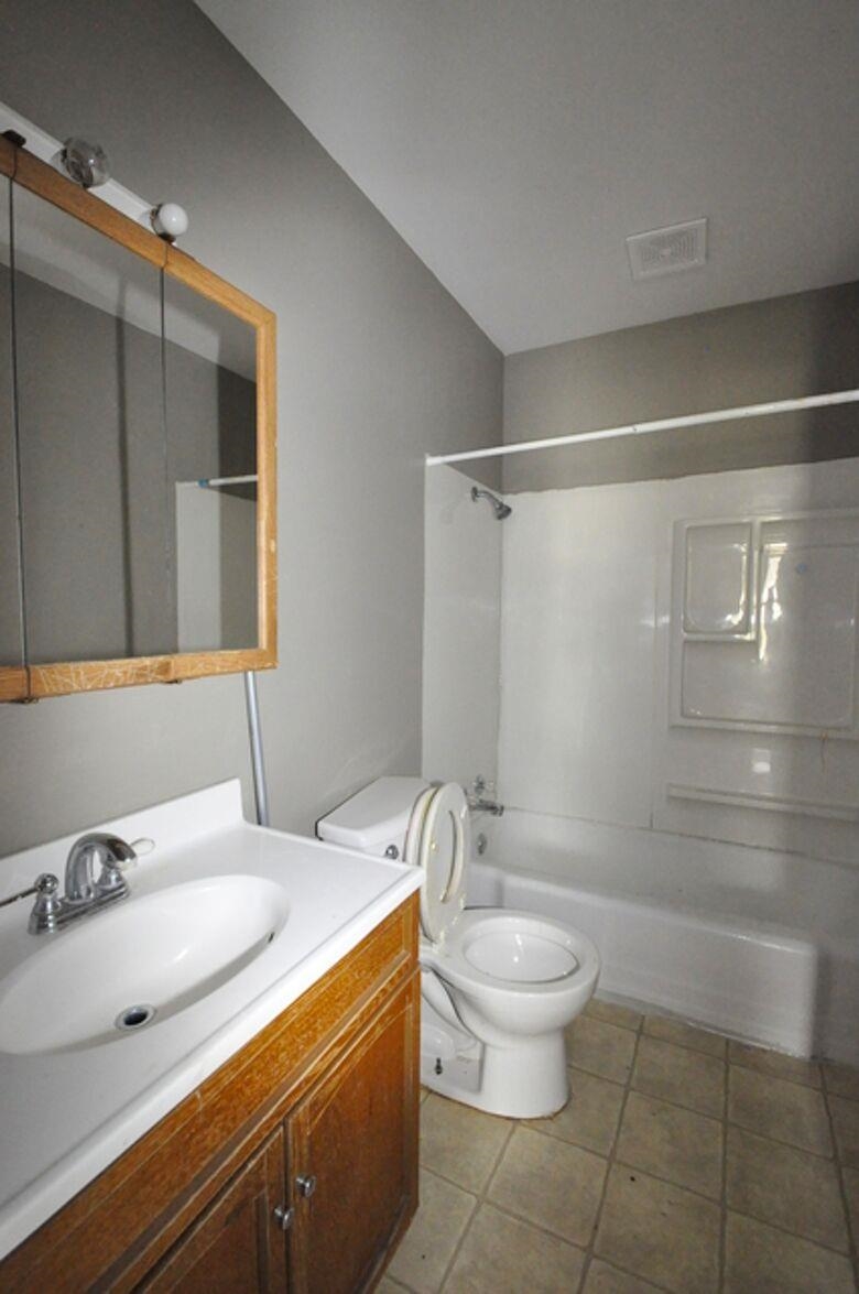 506 Main Street Marseilles, IL 61341 - Photo 6 of 8 a bathroom with a sink toilet and shower