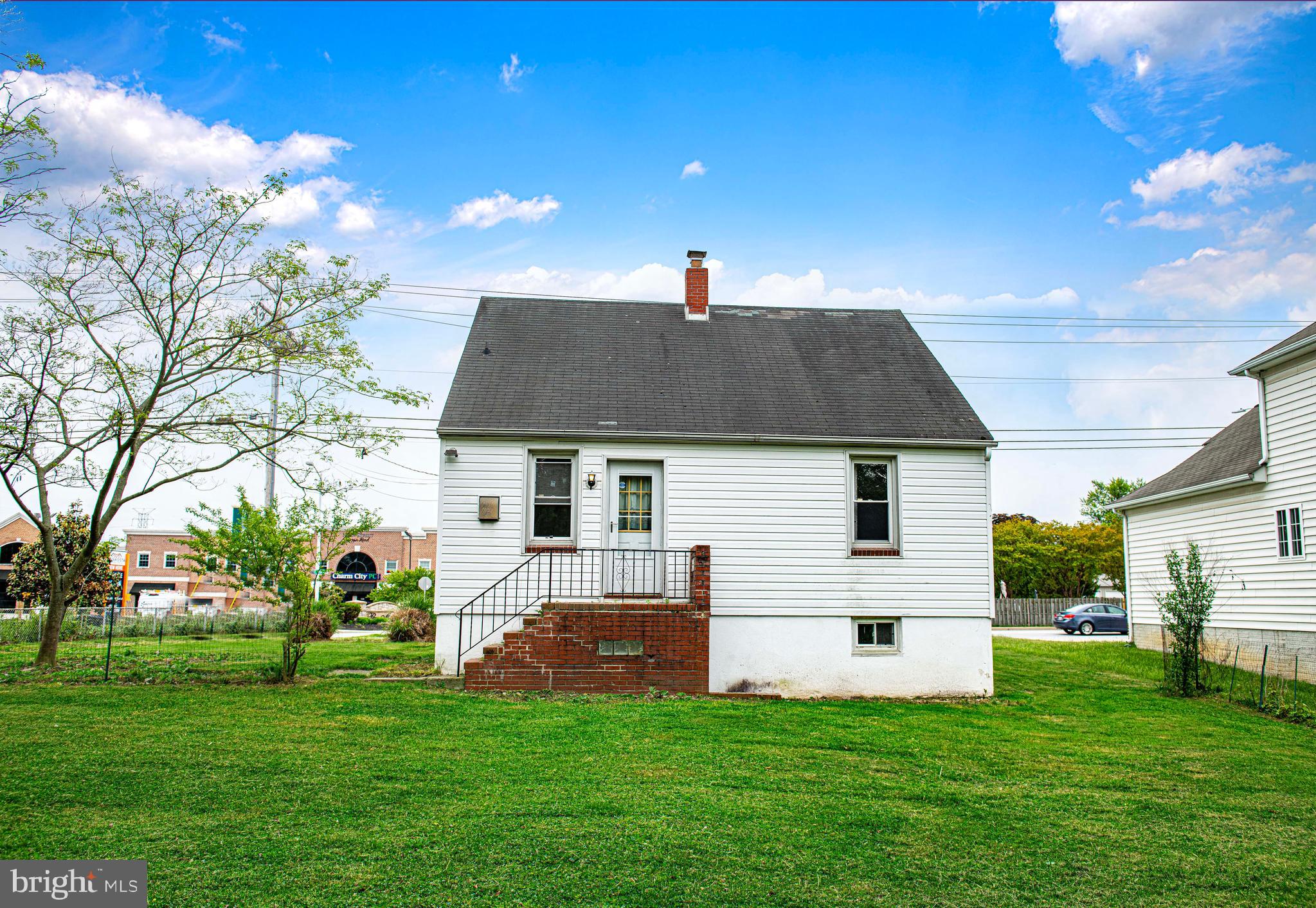 3608 East Joppa Road Baltimore, MD 21234 - Photo 21 of 29 Backyard view of home w/ brick porch & stairs