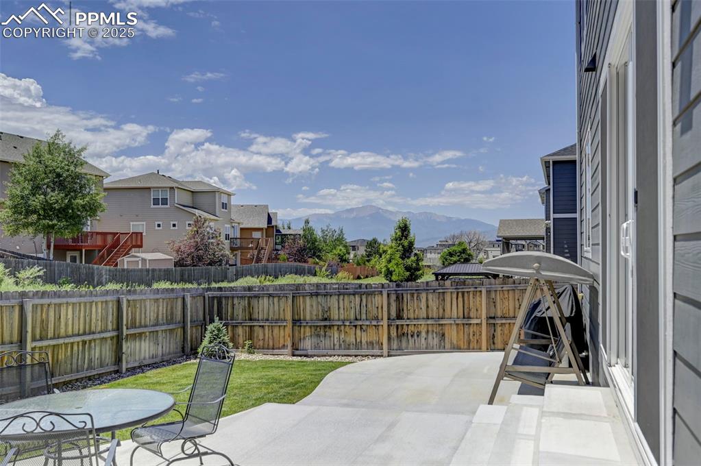 6237 Bodacious Circle Colorado Springs, CO 80923 - Photo 32 of 33 Fenced backyard featuring a residential view, a patio, and a mountain view