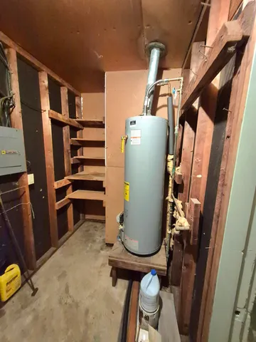 a view of storage and utility room with refrigerator washer and dryer
