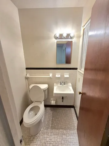 a bathroom with a toilet and a sink