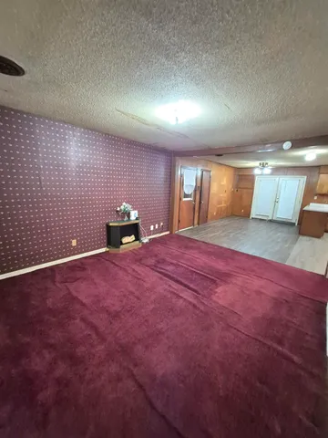 a bedroom with a bed and a potted plant