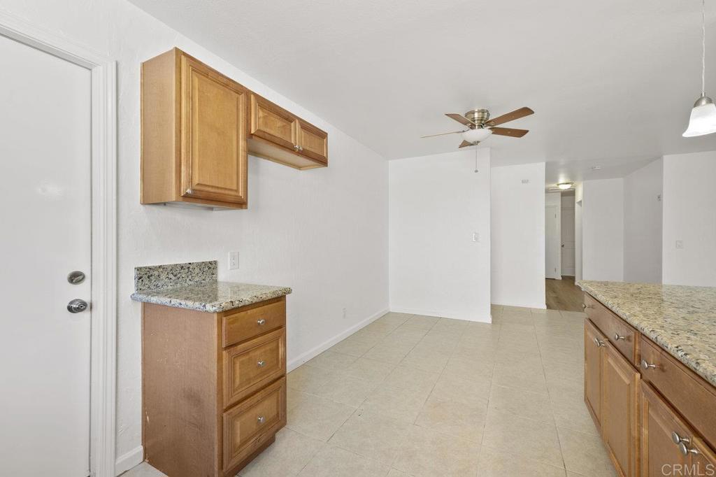 3129 Glenn Road Oceanside, CA 92056 - Photo 15 of 31 a kitchen with stainless steel appliances granite countertop a sink and a refrigerator