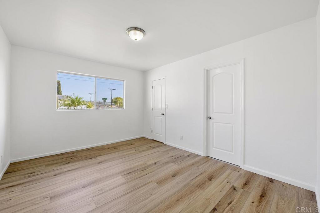 3129 Glenn Road Oceanside, CA 92056 - Photo 17 of 31 a view of an empty room with wooden floor