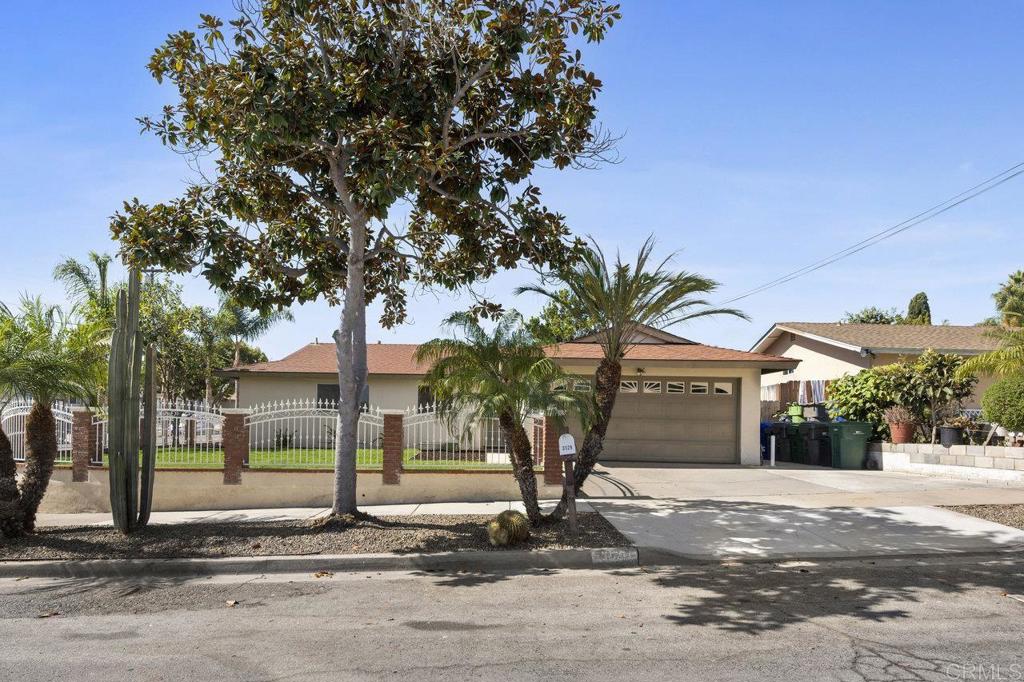 3129 Glenn Road Oceanside, CA 92056 - Photo 2 of 31 a front view of a house with a yard