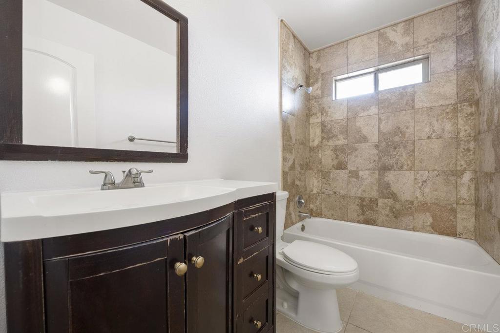 3129 Glenn Road Oceanside, CA 92056 - Photo 22 of 31 a bathroom with a sink a toilet and a bathtub