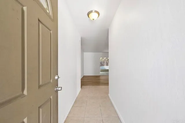 a view of a bathroom from a hallway