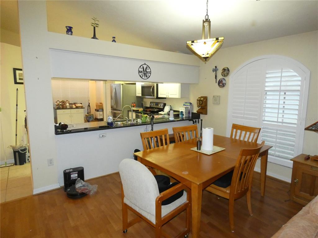 13541 Knotty Lane Hudson, FL 34669 - Photo 12 of 32 a view of a dining room with furniture and window