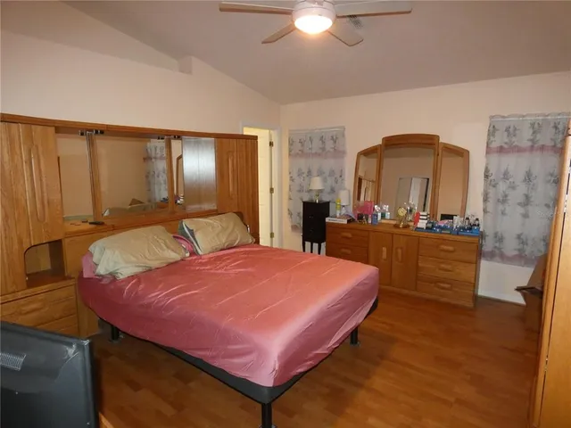 a bed room with a bed and a dresser