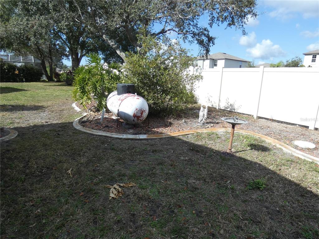 13541 Knotty Lane Hudson, FL 34669 - Photo 25 of 32 a view of a backyard of the house