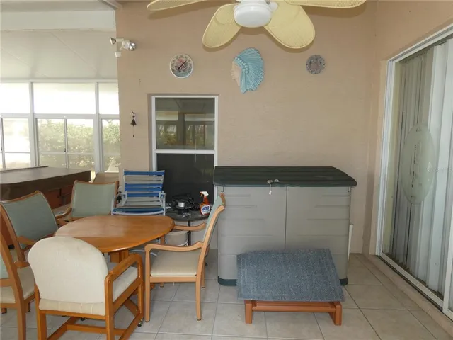 a dining room with furniture and window