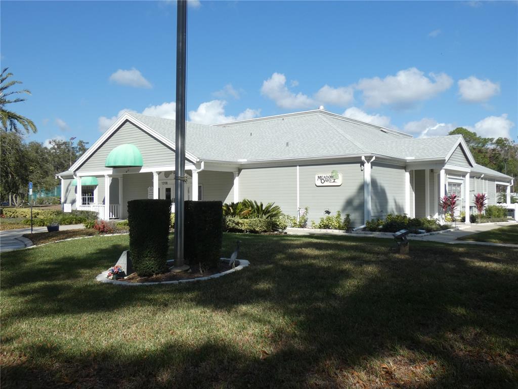 13541 Knotty Lane Hudson, FL 34669 - Photo 31 of 32 a front view of a house with garden