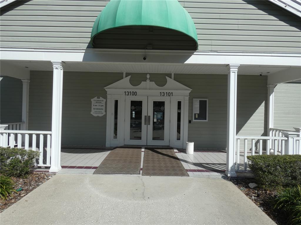 13541 Knotty Lane Hudson, FL 34669 - Photo 32 of 32 a front view of a house with garage
