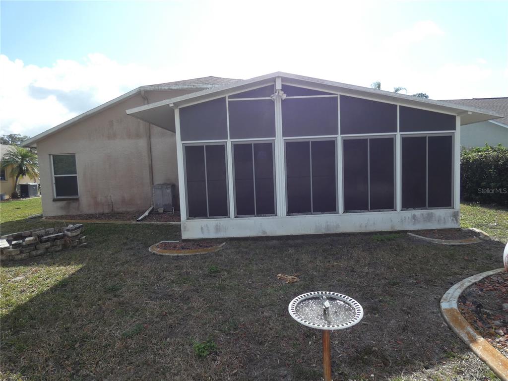 13541 Knotty Lane Hudson, FL 34669 - Photo 6 of 32 a front view of a house