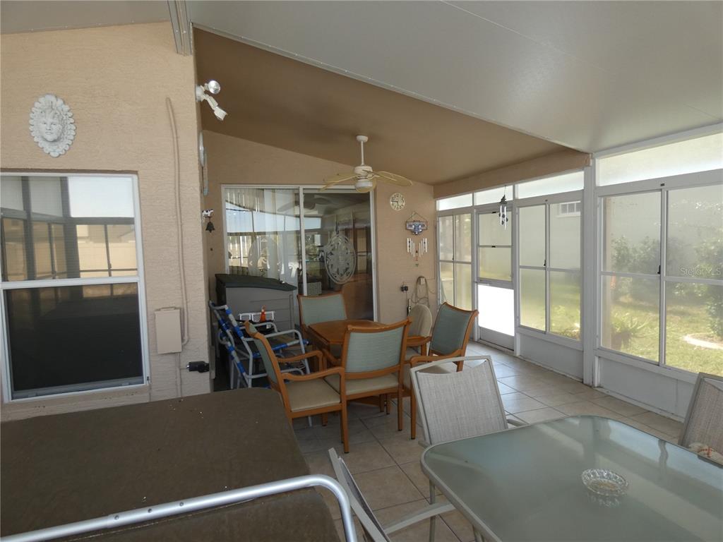 13541 Knotty Lane Hudson, FL 34669 - Photo 7 of 32 a living room with furniture and large windows