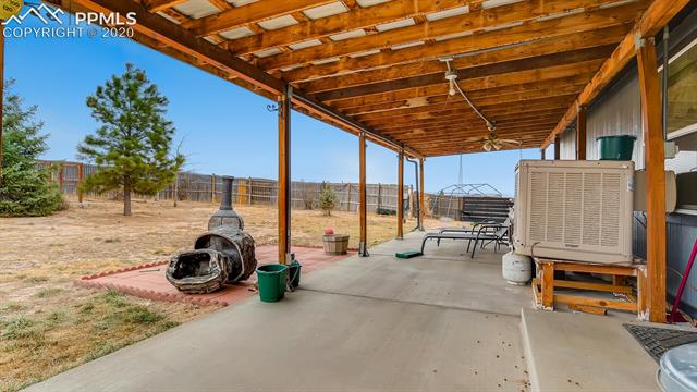 17570 Sage Crest Road Peyton, CO 80831 - Photo 11 of 25 French doors ffrom dining area lead to expansive covered patio. Great entertaining space