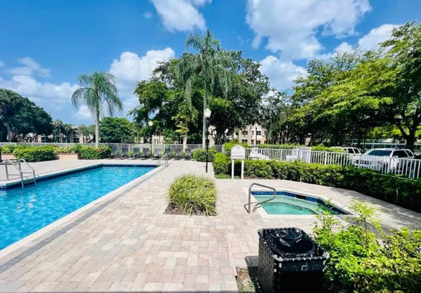 a view of a swimming pool with a patio