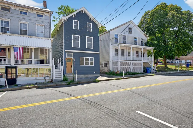 a front view of a building with a street