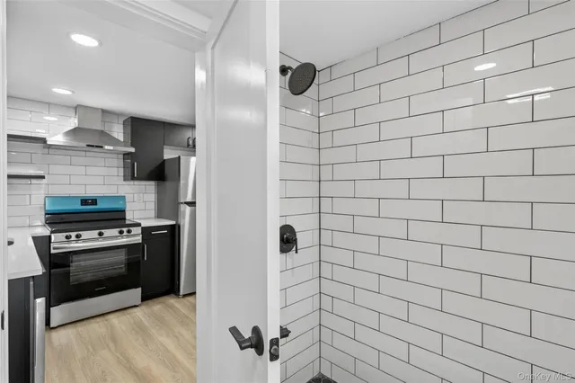 a kitchen with stainless steel appliances cabinets a sink and a counter top space
