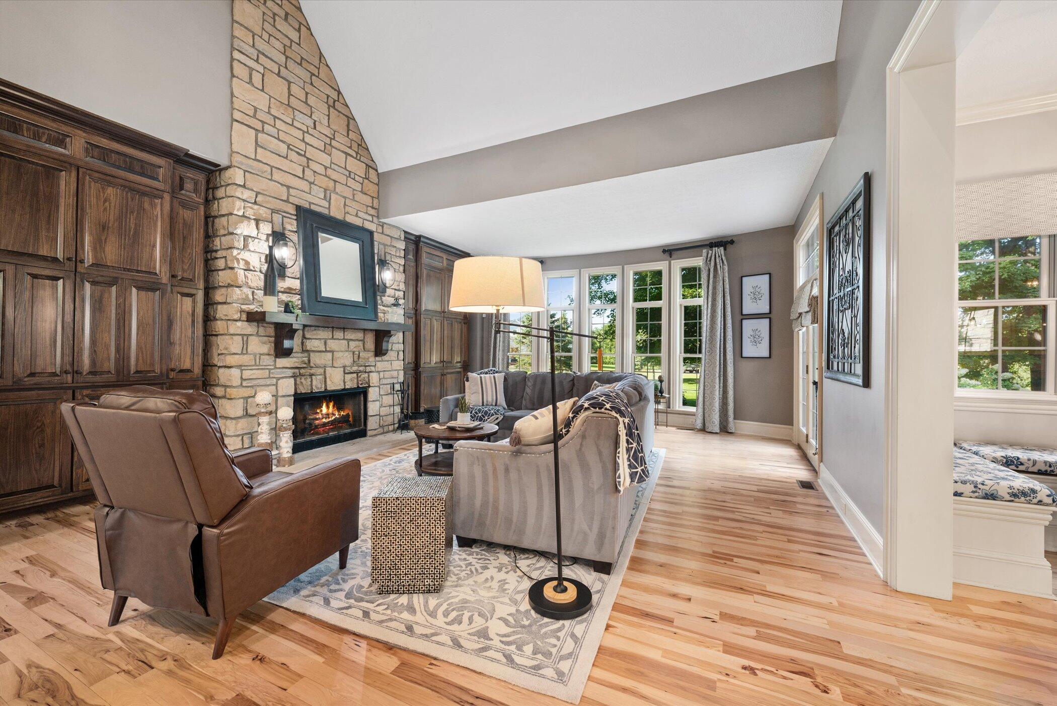 7924 Cook Road Plain City, OH 43064 - Photo 12 of 63 2-Story Stone Fireplace, Hickory Flooring, Custom Built-in Cabinets