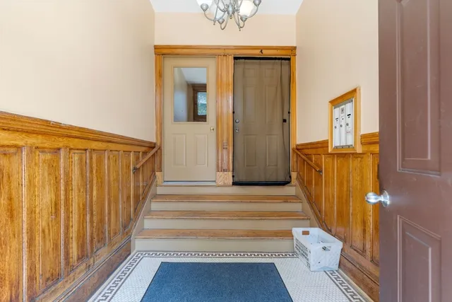 a view of a entryway door with wooden floor