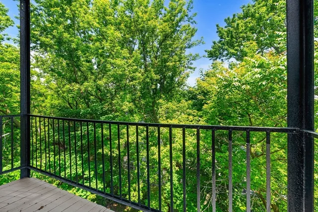 a view of balcony with yard