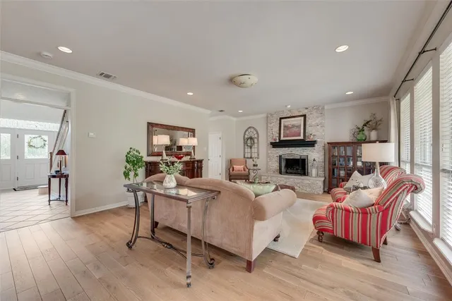 a dinning room with furniture and wooden floor