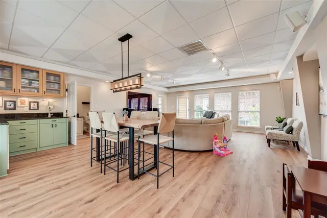 a spacious bathroom with a double vanity sink mirror and bathtub