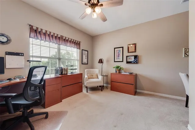 a view of a patio with table and chairs and potted plants