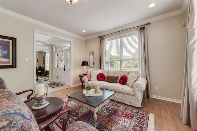 a living room with fireplace furniture and a wooden floor