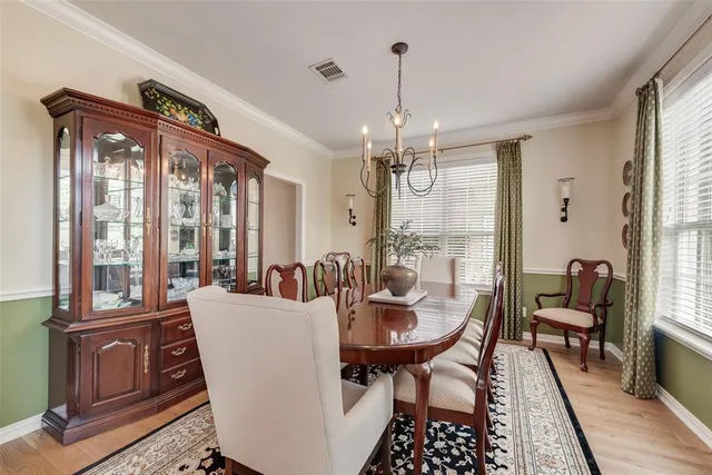 a view of a dining room with furniture and window