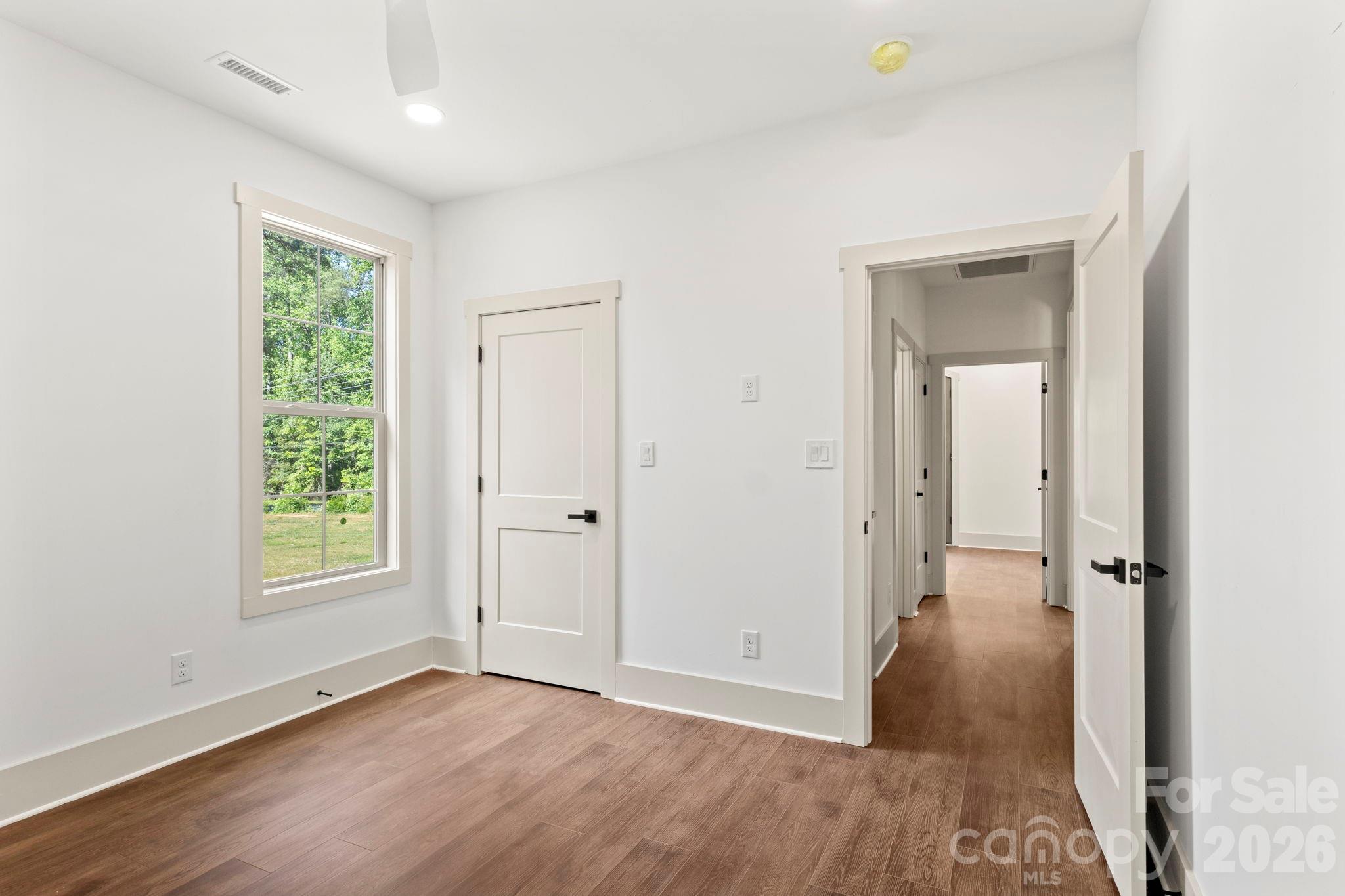 1167 Tirzah Road Rock Hill, SC 29732 - Photo 20 of 25 an empty room with windows and a ceiling fan