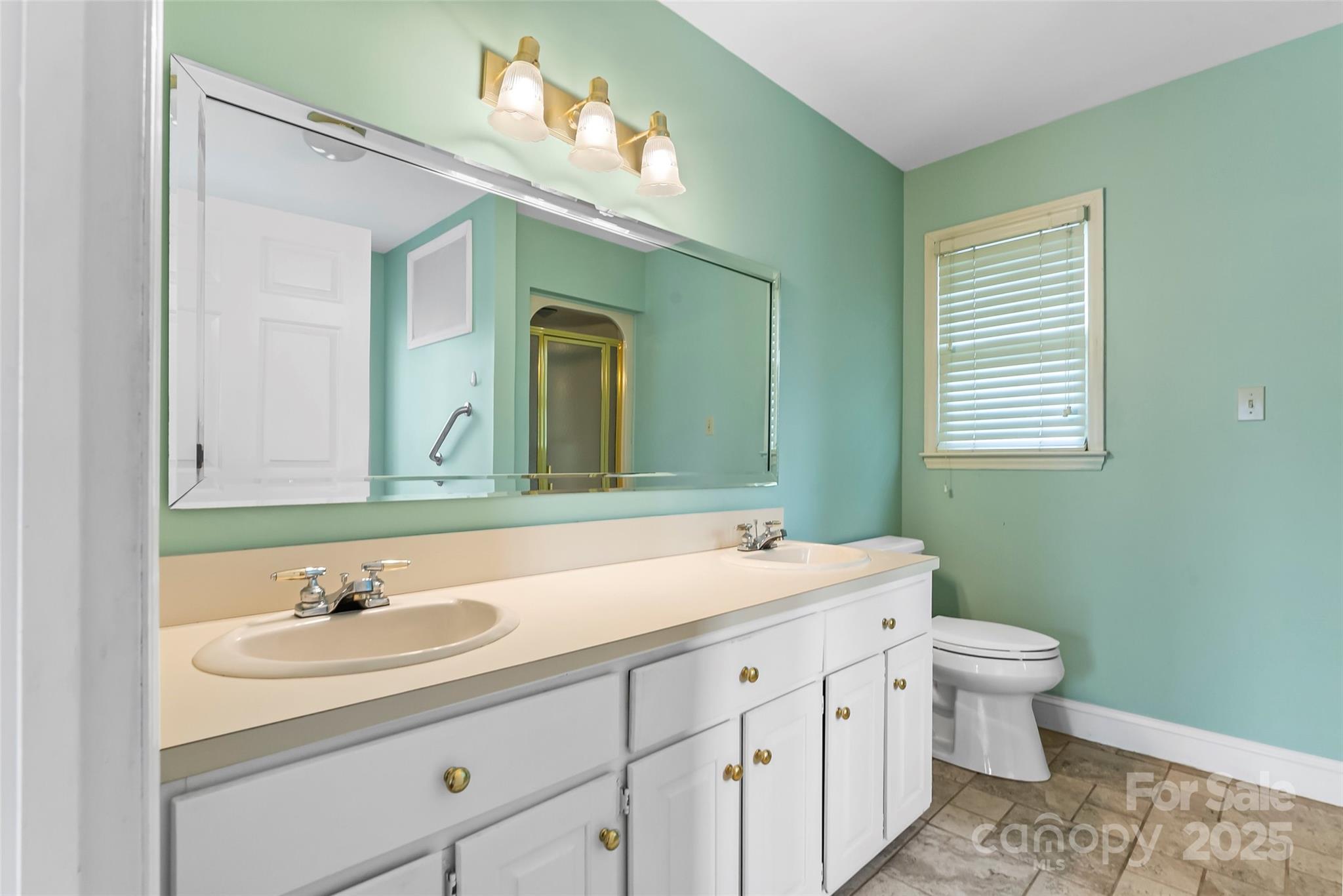3772 Sandy Ford Road Hickory, NC 28602 - Photo 13 of 32 a bathroom with a sink and a mirror