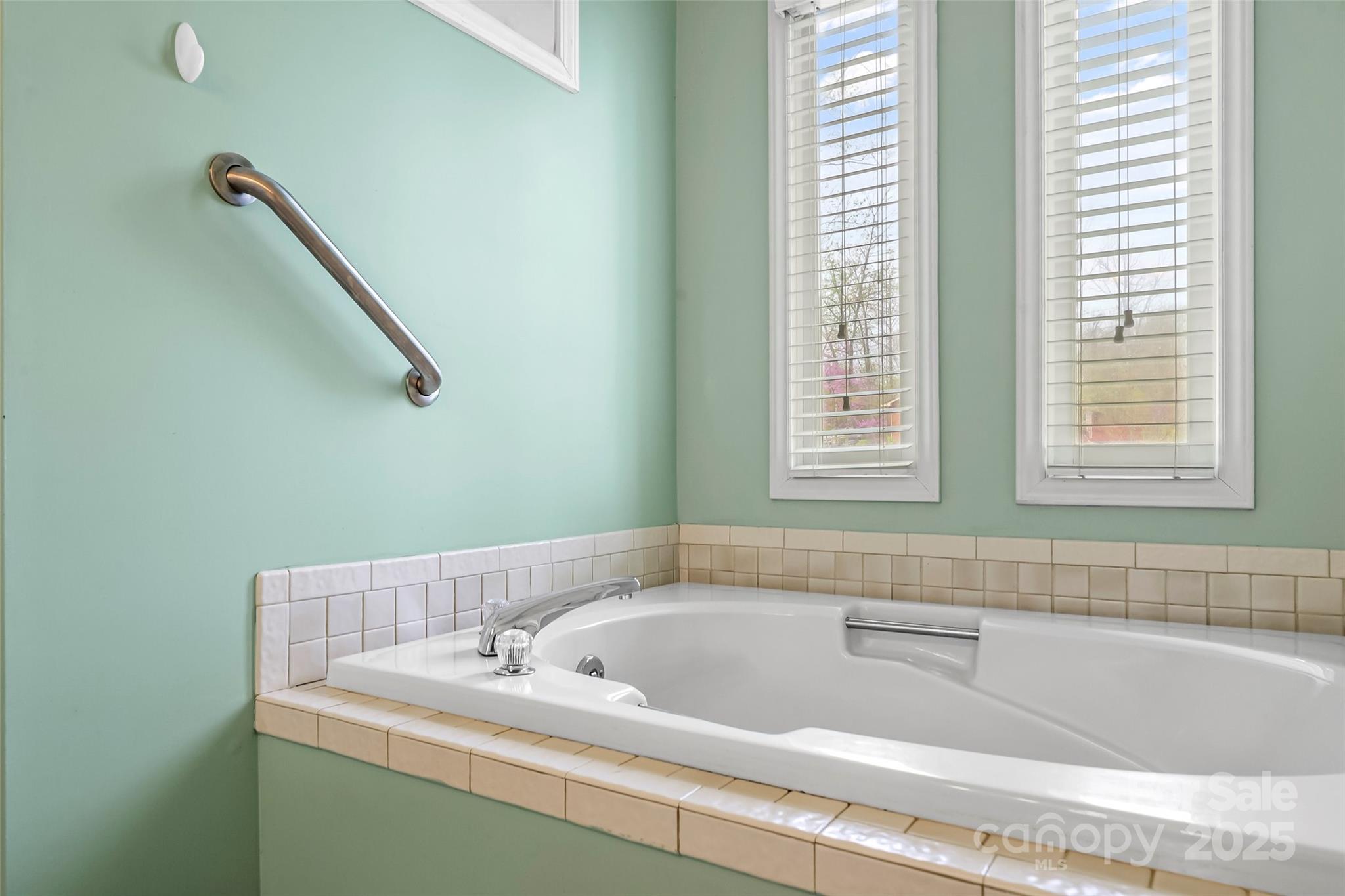 3772 Sandy Ford Road Hickory, NC 28602 - Photo 14 of 32 a bathroom with a bathtub and a window